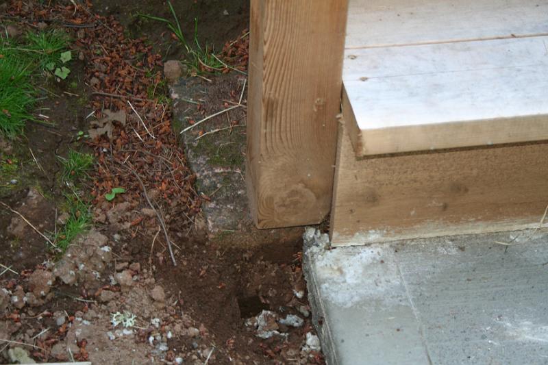 IMG_1739.JPG - Stair posts only sitting on pavers. Nothing to keep it secure